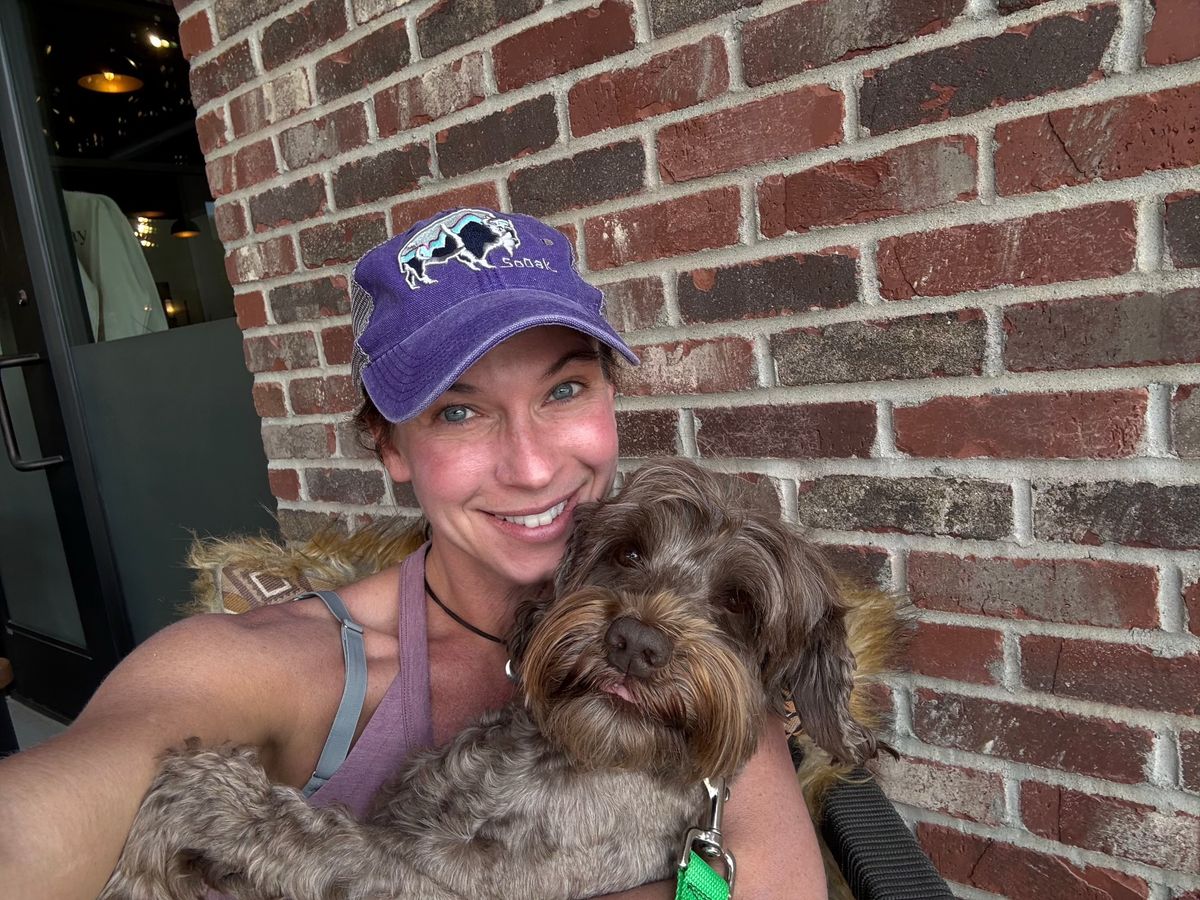 Michelle with Cherry, a chocolate Australian Labradoodle | Spring Valley Australian Labradoodles